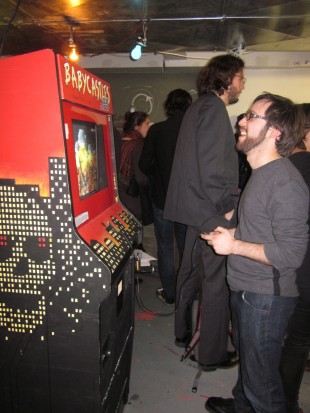 Gallery visitor playing "Killing Spree," a piece by Zach Gage commissioned for the opening of "Terraforms."